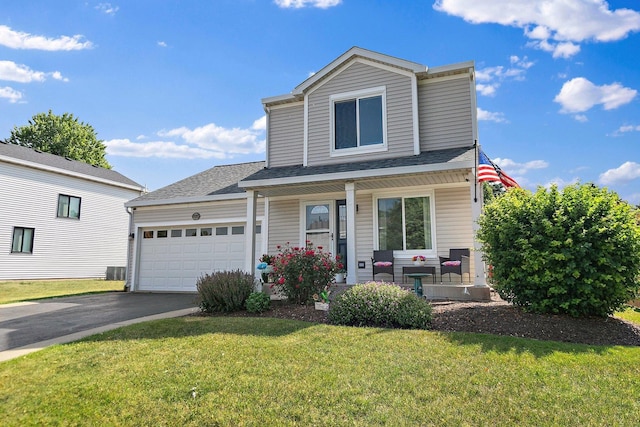 1239 Angeline Dr, South Elgin, IL 60177 - traditional home featuring a porch, a front yard, a garage, asphalt driveway, and a shingled roof