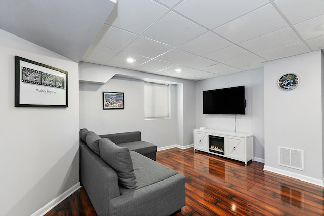 1239 Angeline Dr, South Elgin, IL 60177 - living area with dark wood-type flooring, a paneled ceiling, recessed lighting, and a lit fireplace