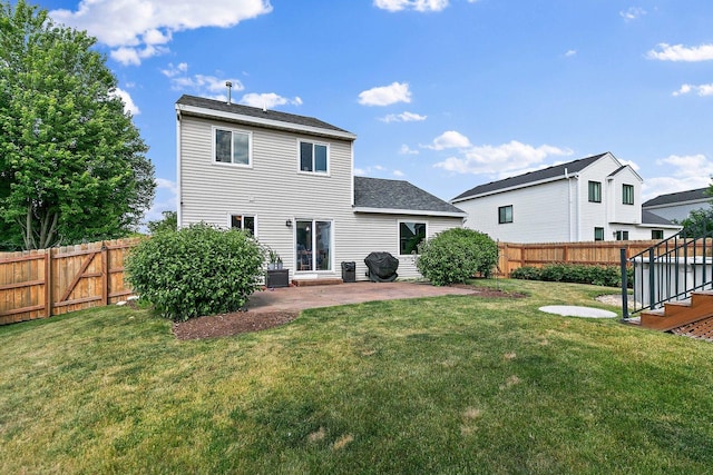 1239 Angeline Dr, South Elgin, IL 60177 - back of property with a patio area, a fenced backyard, and a shingled roof