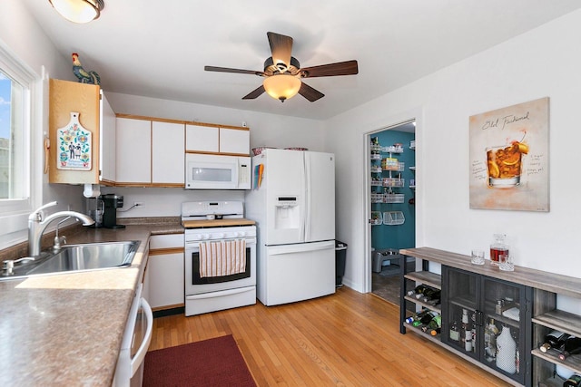 1239 Angeline Dr, South Elgin, IL 60177 - kitchen featuring white appliances, a ceiling fan, light wood-style floors, and plenty of natural light