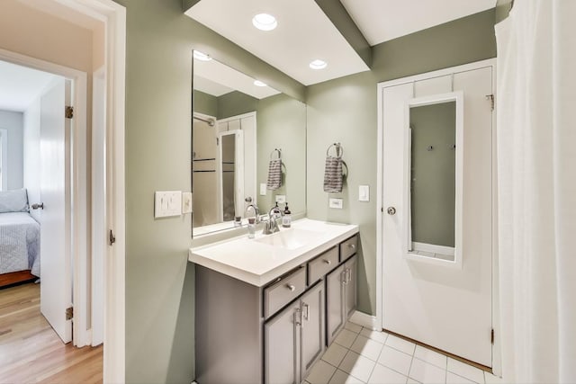 920 N Lakeside Dr Unit 1D, Vernon Hills, IL 60061 - bathroom featuring vanity, ensuite bathroom, and tile patterned floors