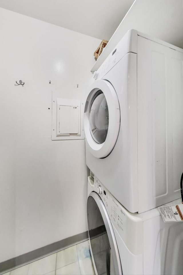 920 N Lakeside Dr Unit 1D, Vernon Hills, IL 60061 - washroom featuring stacked washer and clothes dryer and tile patterned floors