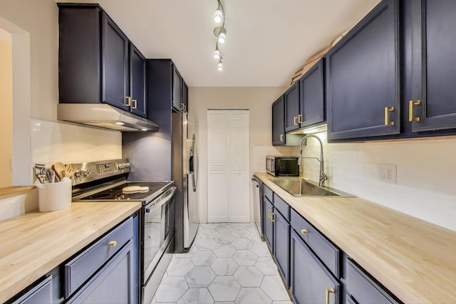 920 N Lakeside Dr Unit 1D, Vernon Hills, IL 60061 - kitchen featuring stainless steel appliances, butcher block counters, under cabinet range hood, and tasteful backsplash