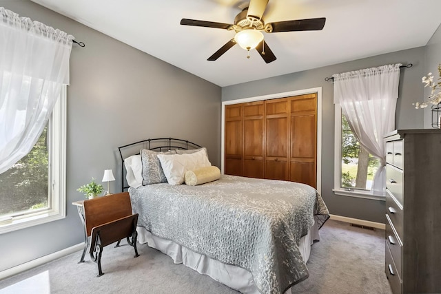 45W984 Mcdonald Rd, Hampshire, IL 60140 - carpeted bedroom featuring multiple windows, a closet, and ceiling fan