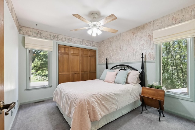 45W984 Mcdonald Rd, Hampshire, IL 60140 - bedroom featuring light carpet, multiple windows, a closet, a ceiling fan, and wallpapered walls