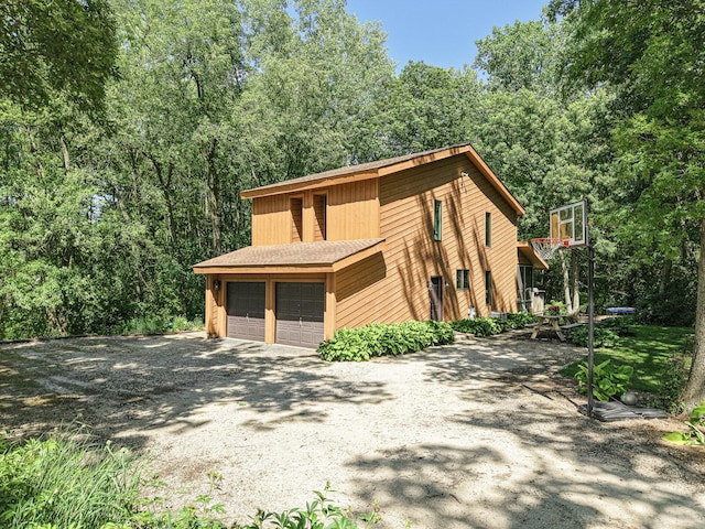 45W984 Mcdonald Rd, Hampshire, IL 60140 - view of front of property with a garage, a shingled roof, and gravel driveway