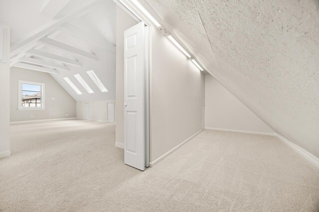 5632 S Natoma Ave, Chicago, IL 60638 - bonus room with vaulted ceiling, carpet flooring, and a textured ceiling