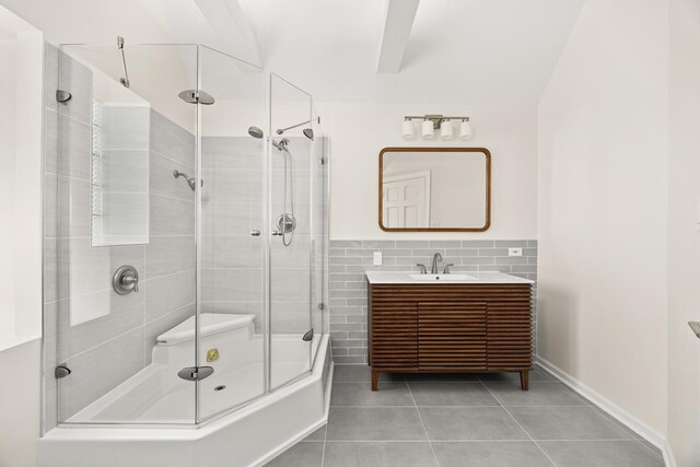 5632 S Natoma Ave, Chicago, IL 60638 - full bath with a stall shower, tile patterned flooring, vanity, and tile walls