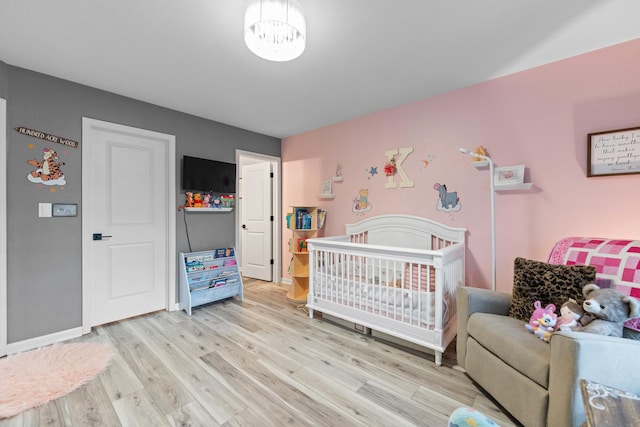 2493 Alison Ave, Pingree Grove, IL 60140 - bedroom featuring light wood finished floors and a crib