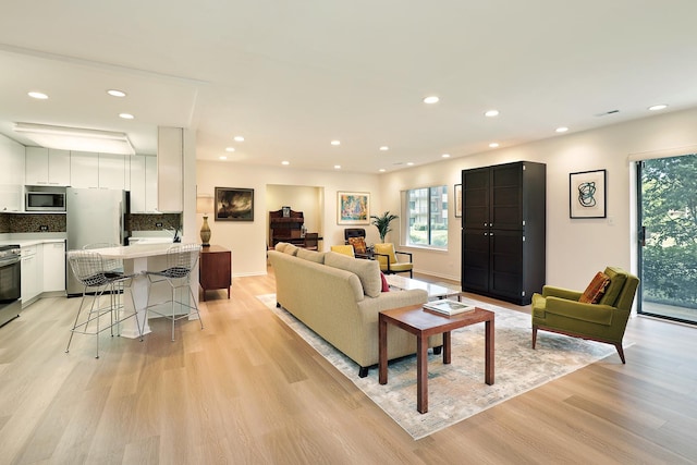 3030 Pheasant Creek Dr Unit 102, Northbrook, IL 60062 - living area with healthy amount of natural light, light wood-type flooring, and recessed lighting