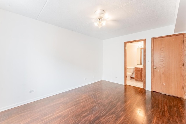 8710 W Evelyn Ln Unit 201, Chicago, IL 60656 - unfurnished bedroom with wood finished floors and ensuite bath