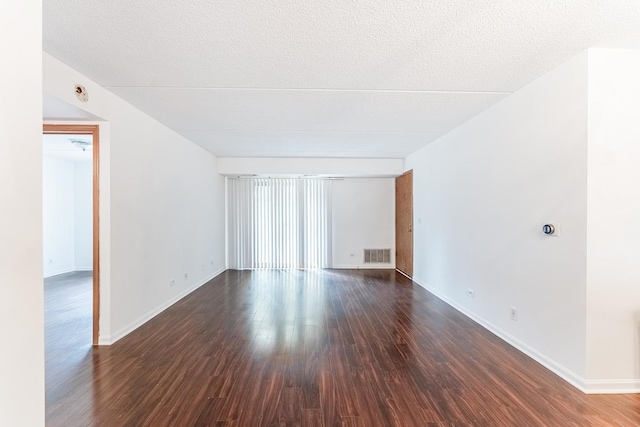 8710 W Evelyn Ln Unit 201, Chicago, IL 60656 - spare room with dark wood-type flooring
