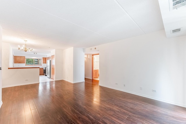 8710 W Evelyn Ln Unit 201, Chicago, IL 60656 - unfurnished living room with a chandelier and dark wood-style flooring