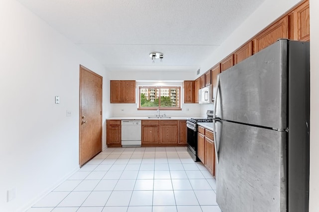 8710 W Evelyn Ln Unit 201, Chicago, IL 60656 - kitchen with appliances with stainless steel finishes, brown cabinets, and light countertops