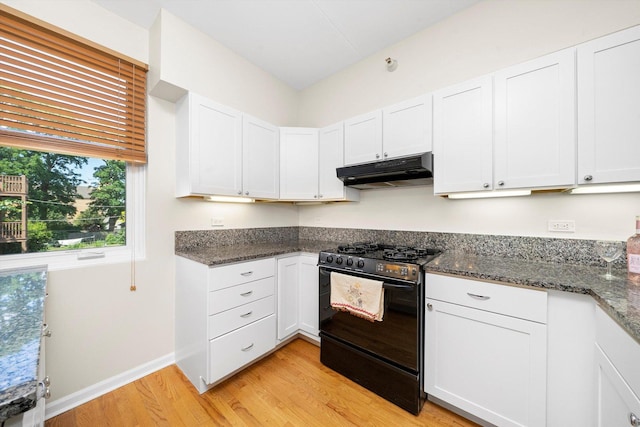1036 Susan Collins Ln, Oak Park, IL 60302 - kitchen with black gas stove, under cabinet range hood, light wood-style flooring, white cabinets, and dark stone counters