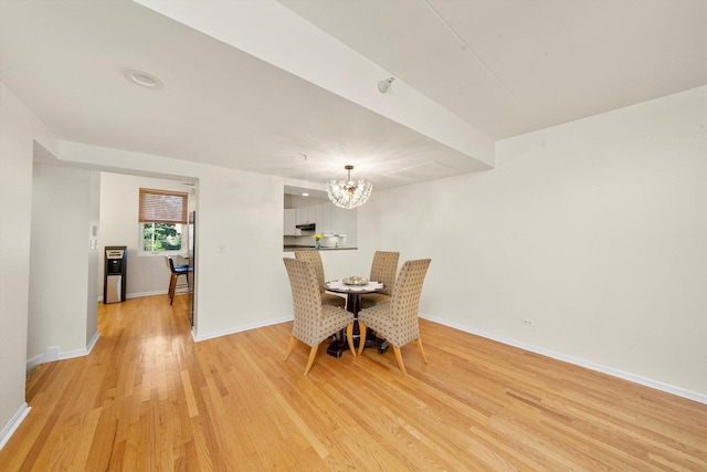 1036 Susan Collins Ln, Oak Park, IL 60302 - dining room featuring a chandelier and light wood-type flooring