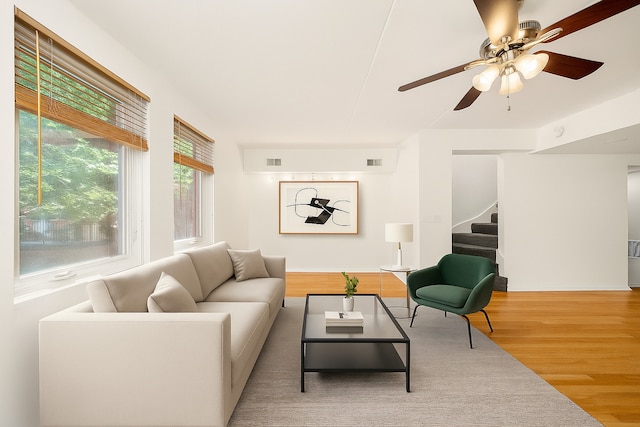 1036 Susan Collins Ln, Oak Park, IL 60302 - living area featuring stairway, wood finished floors, and ceiling fan