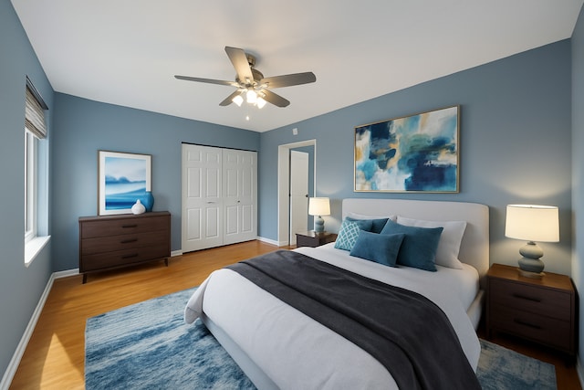 1036 Susan Collins Ln, Oak Park, IL 60302 - bedroom with wood finished floors, a closet, and a ceiling fan