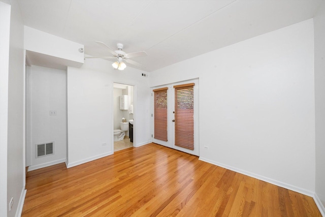 1036 Susan Collins Ln, Oak Park, IL 60302 - unfurnished bedroom with light wood finished floors, french doors, ensuite bath, and a ceiling fan