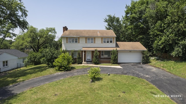 3S138 Park Blvd, Glen Ellyn, IL 60137 - view of front facade with a chimney, asphalt driveway, a garage, a front lawn, and covered porch