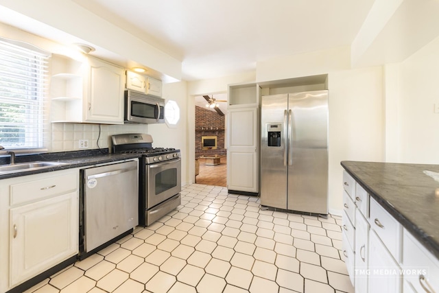3S138 Park Blvd, Glen Ellyn, IL 60137 - kitchen featuring stainless steel appliances, open shelves, dark countertops, and a ceiling fan