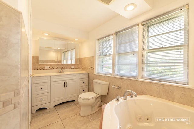3S138 Park Blvd, Glen Ellyn, IL 60137 - full bathroom with tile patterned flooring, a jetted tub, tile walls, vanity, and a wainscoted wall