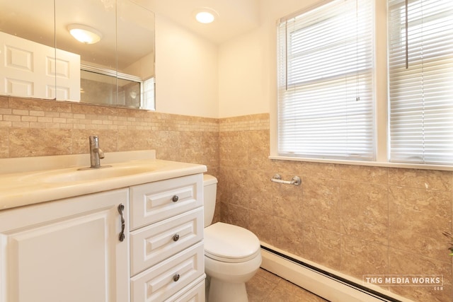 3S138 Park Blvd, Glen Ellyn, IL 60137 - full bath with a baseboard heating unit, tile walls, tile patterned flooring, plenty of natural light, and vanity