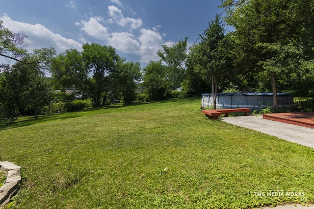 3S138 Park Blvd, Glen Ellyn, IL 60137 - view of green lawn featuring an outdoor pool, a wooden deck, and view of scattered trees
