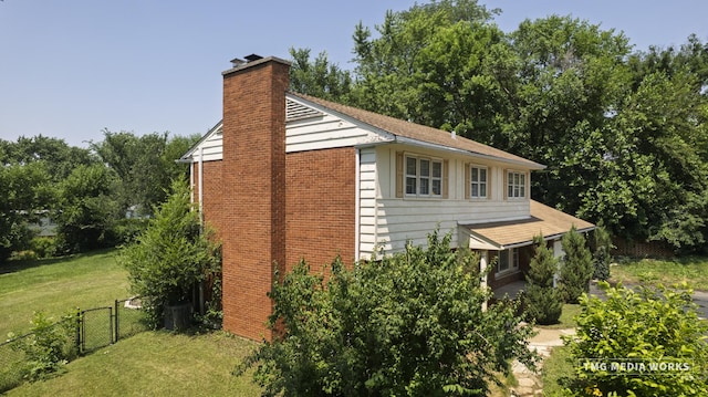 3S138 Park Blvd, Glen Ellyn, IL 60137 - view of home's exterior featuring a chimney and brick siding