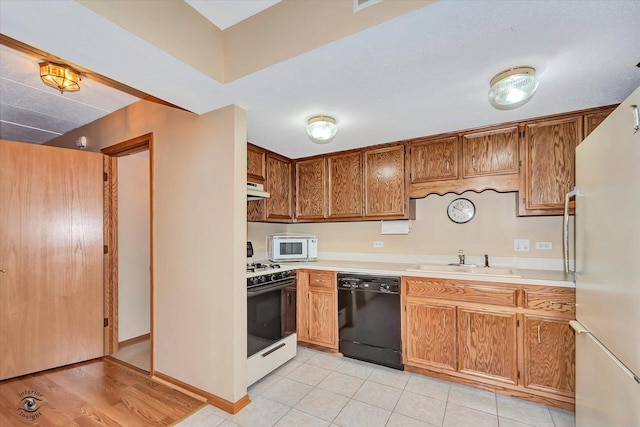 4950 134th Ct Unit 510, Crestwood, IL 60418 - kitchen featuring white appliances, light countertops, under cabinet range hood, and brown cabinetry
