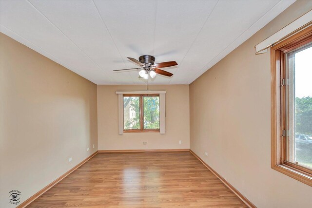 4950 134th Ct Unit 510, Crestwood, IL 60418 - unfurnished room featuring healthy amount of natural light, light wood-style flooring, and a ceiling fan