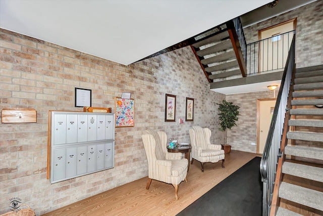 4950 134th Ct Unit 510, Crestwood, IL 60418 - stairs featuring mail area, wood finished floors, and brick wall