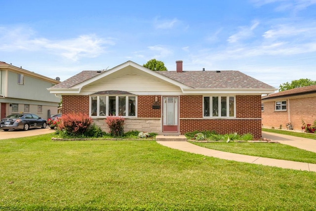 12236 S Hamlin Ave, Alsip, IL 60803 - view of front of house featuring a front lawn, a chimney, roof with shingles, and brick siding