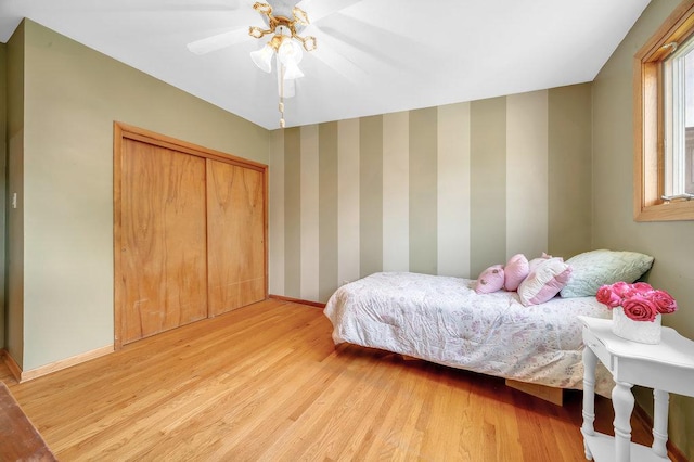 12236 S Hamlin Ave, Alsip, IL 60803 - bedroom featuring light wood finished floors, a ceiling fan, and a closet