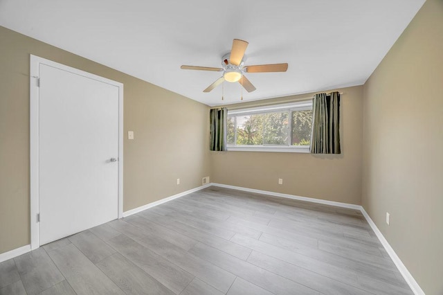 12236 S Hamlin Ave, Alsip, IL 60803 - empty room featuring ceiling fan and wood finished floors