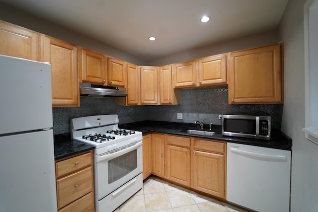 1460 Fairlane Dr Unit 119, Schaumburg, IL 60193 - kitchen with white appliances, under cabinet range hood, tasteful backsplash, light tile patterned floors, and dark stone counters
