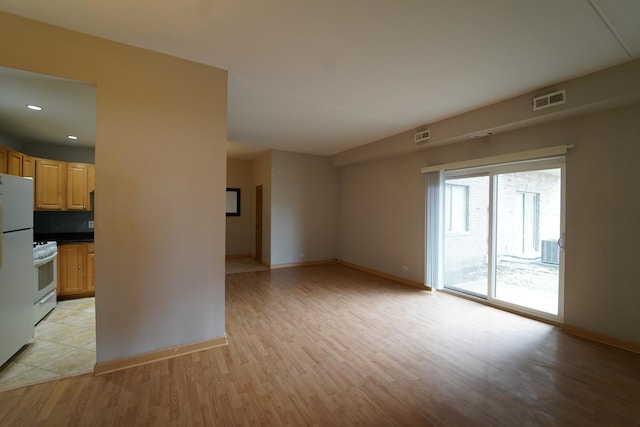 1460 Fairlane Dr Unit 119, Schaumburg, IL 60193 - unfurnished living room featuring light wood finished floors and recessed lighting