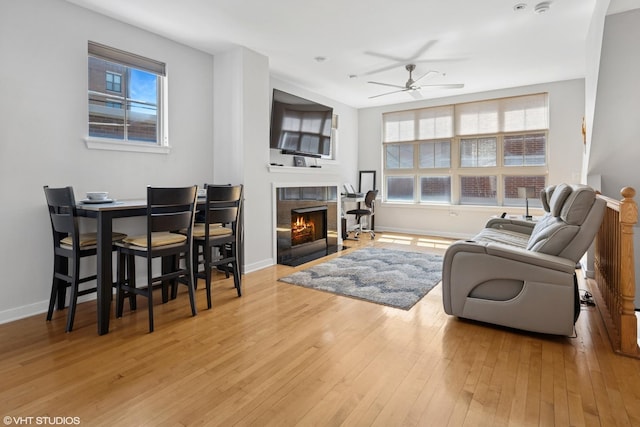 2321 S Wabash Ave Unit 12, Chicago, IL 60616 - living room featuring a ceiling fan, a fireplace, and wood-type flooring