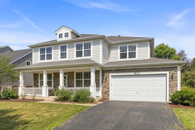 802 Barton Dr, Oswego, IL 60543 - view of front of property featuring driveway, a porch, stone siding, an attached garage, and a front yard