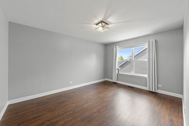802 Barton Dr, Oswego, IL 60543 - unfurnished room with dark wood-style flooring