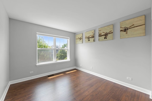 802 Barton Dr, Oswego, IL 60543 - unfurnished room featuring baseboards and dark wood finished floors