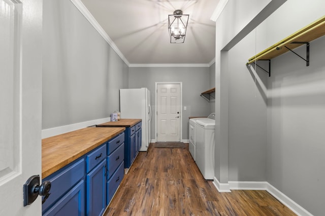 802 Barton Dr, Oswego, IL 60543 - washroom with washer and clothes dryer, crown molding, dark wood finished floors, and a chandelier