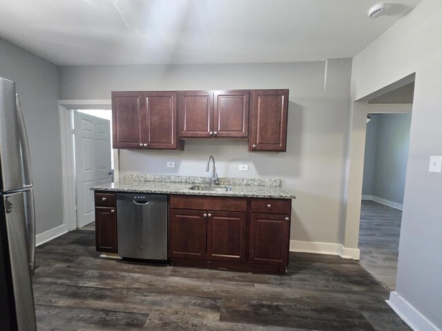 6646 S Wabash Ave, Chicago, IL 60637 - kitchen featuring appliances with stainless steel finishes, dark wood-type flooring, and light stone counters