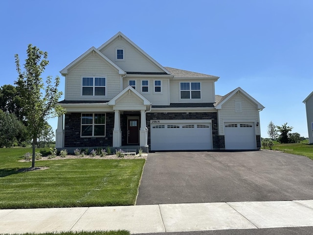 25805 W Springside St, Plainfield, IL 60586 - craftsman inspired home featuring asphalt driveway, a front yard, an attached garage, and stone siding
