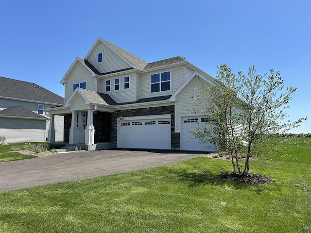 25805 W Springside St, Plainfield, IL 60586 - craftsman-style house featuring a garage, asphalt driveway, a front lawn, and stone siding
