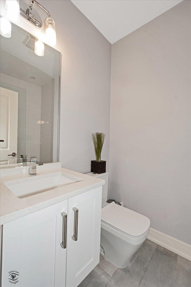 609 E 48th St, Chicago, IL 60615 - half bath featuring vanity and toilet