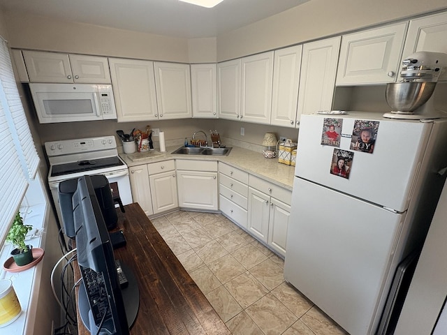 701 Ridge Rd Unit 1D, Wilmette, IL 60091 - kitchen with white appliances, white cabinetry, and light countertops