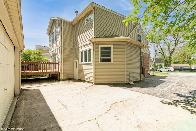 235 S Warrington Rd, Des Plaines, IL 60016 - back of house featuring a patio and a deck