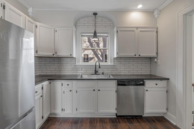 150 N Raynor Ave, Joliet, IL 60435 - kitchen featuring stainless steel appliances, dark countertops, white cabinetry, crown molding, and recessed lighting