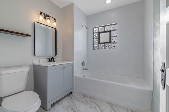 150 N Raynor Ave, Joliet, IL 60435 - bathroom featuring vanity, tub / shower combination, and marble look tiles